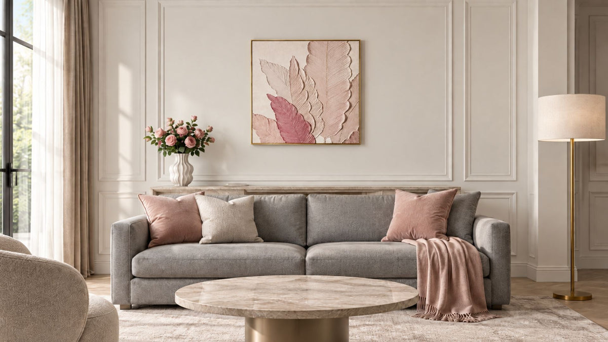 Large textured framed wall art hung above a grey sofa in a neutral living room