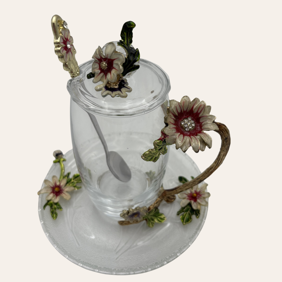 Real product photo of the glass tea cup and saucer with metal pink and gold flowers