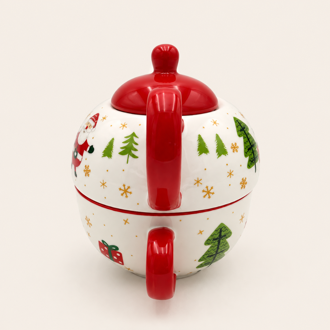 Back view of the Santa teapot showing the red handle and Christmas tree design